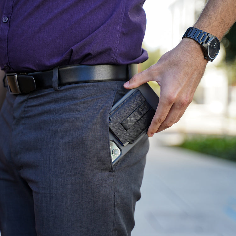 MagBak wallet on iPhone case being placed into pants pocket