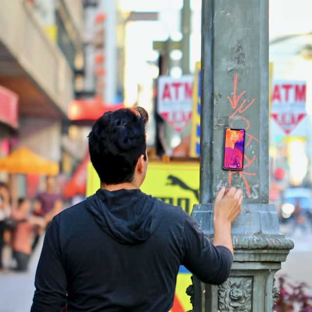 Mounting the iPhone with a MagBak case on a city street metal light pole. 