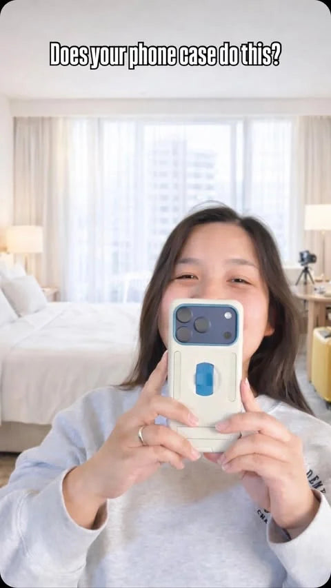 Vannie Beauty holding a beige and blue MagBak Elite Case for iPhone 17 in a bright room